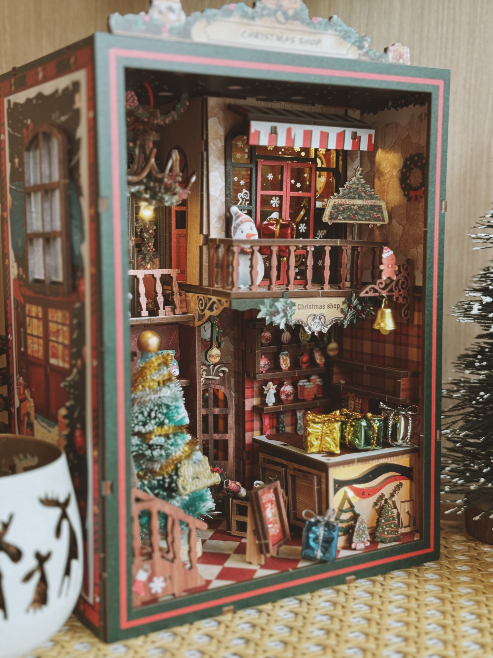 Detailed model of a store with Christmas decorations inside a box