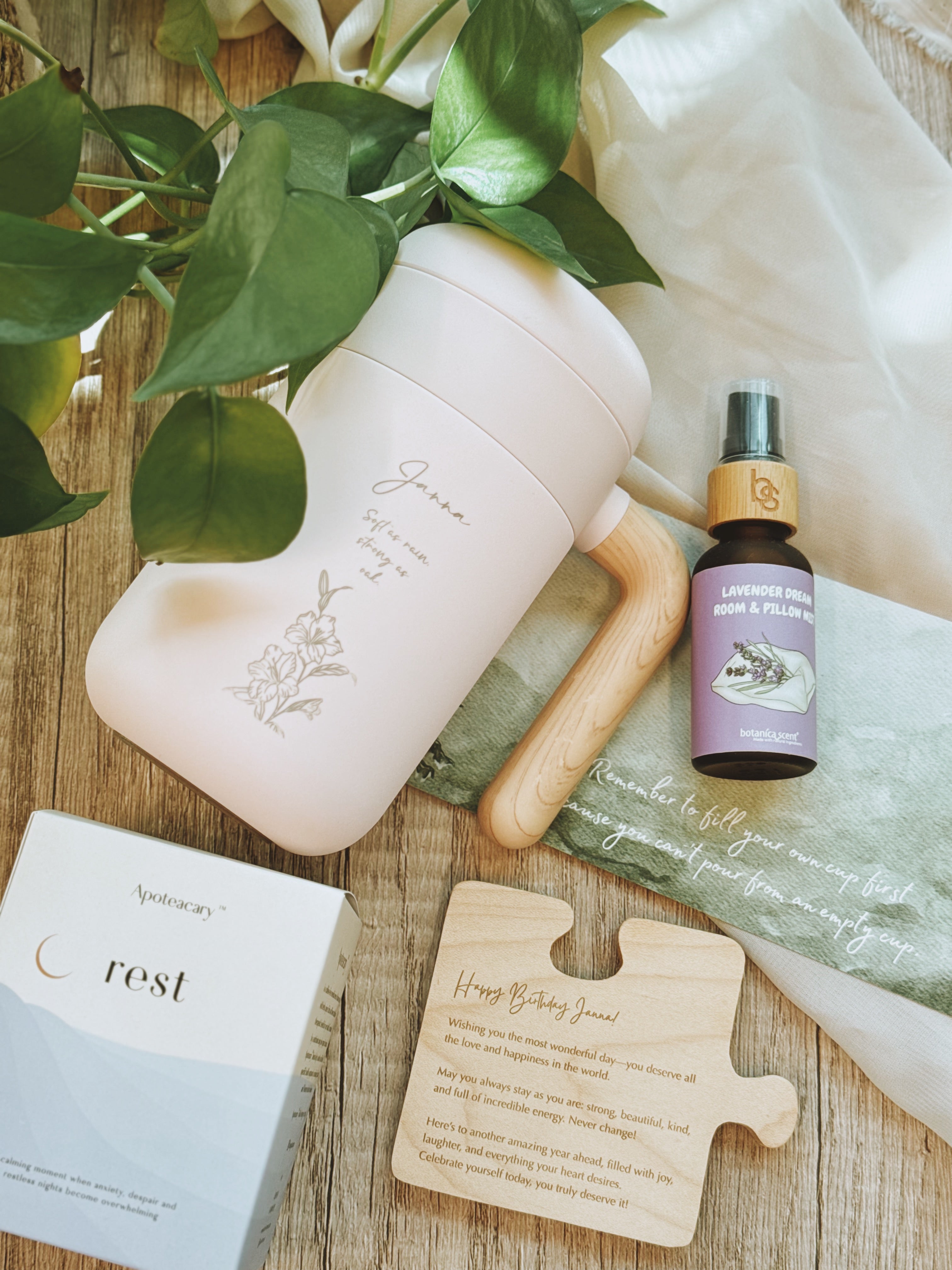 Pink tea mug with wooden handle, lavender essential oil pillow mist, herbal tea and engraved message on wooden coaster