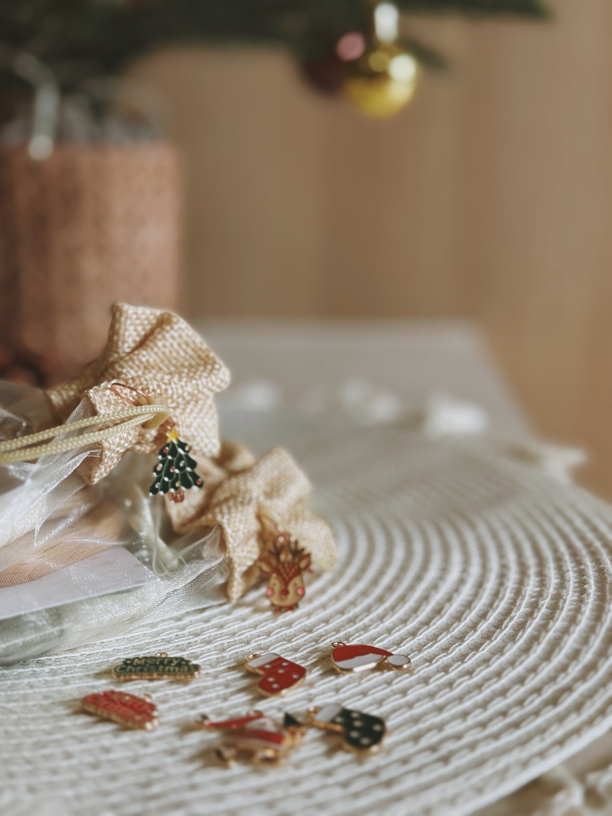 Decorative earrings on a textured surface with a blurred background